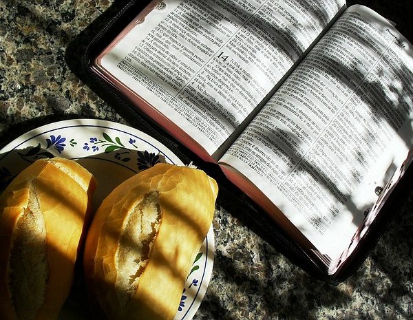 Open Bible and loaf of bread