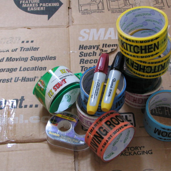 moving boxes, tape, markers