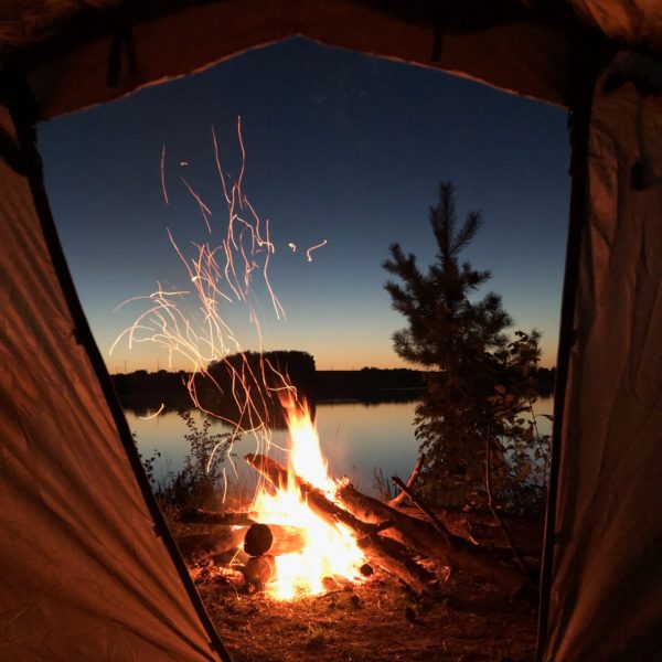 view of campfire from inside tent
