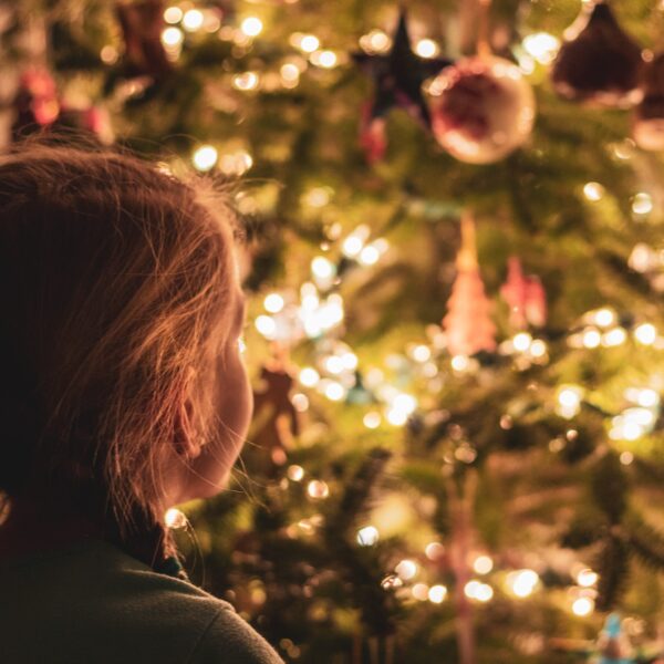 Girl gazing at Christmas tree