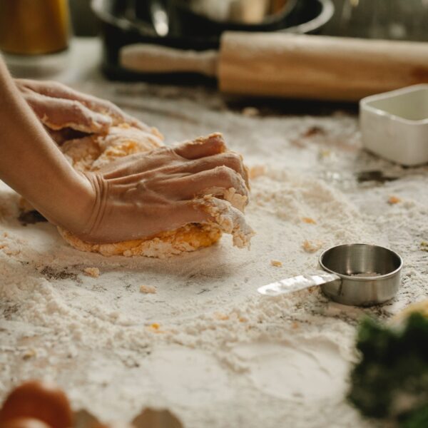 hands kneading bread dough