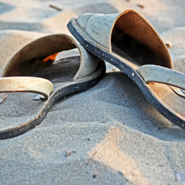 The Sandal Covenant. A pair of sandals in the sand.